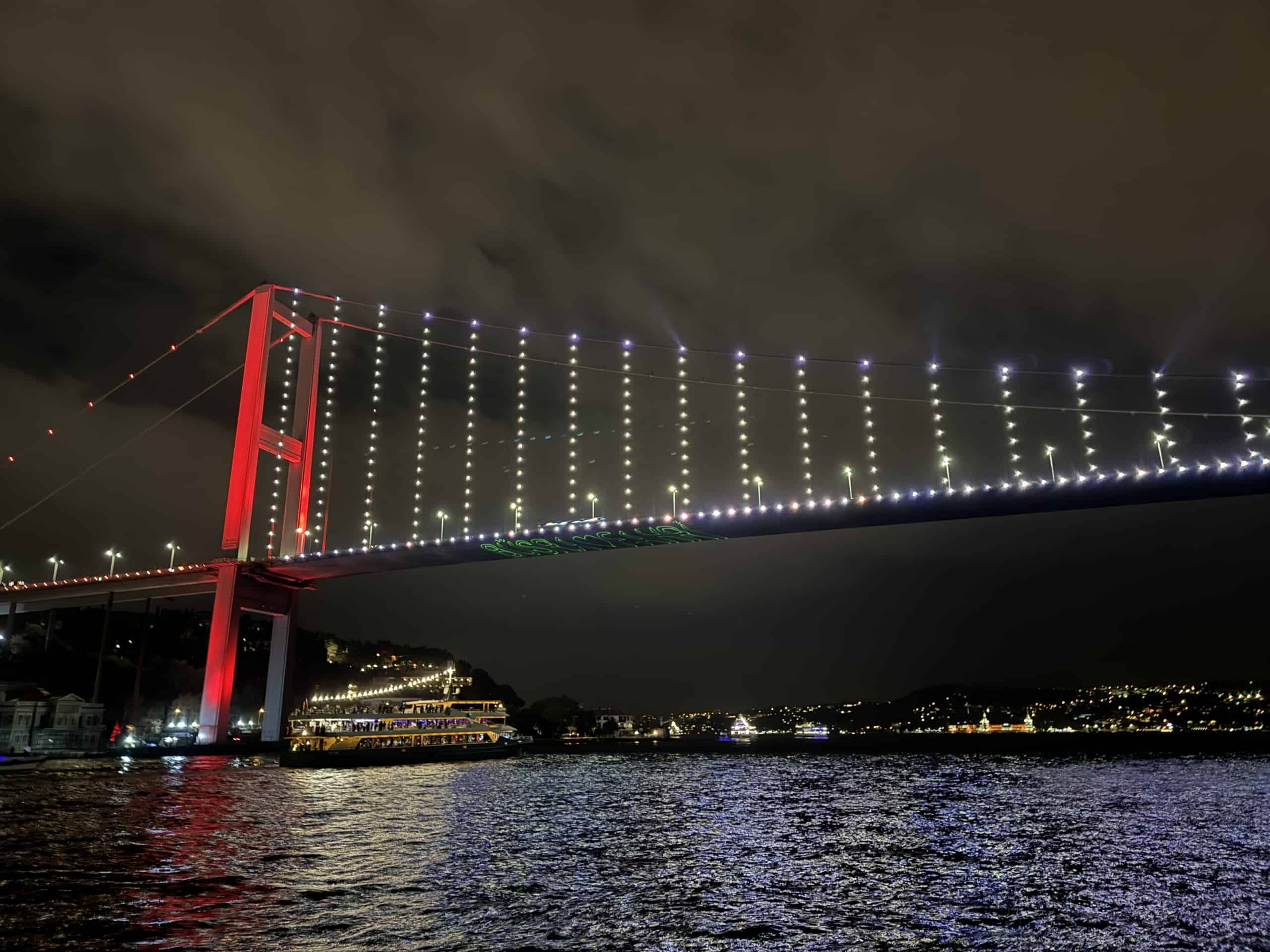 The Bosphorus Bridge lit up with lights at night